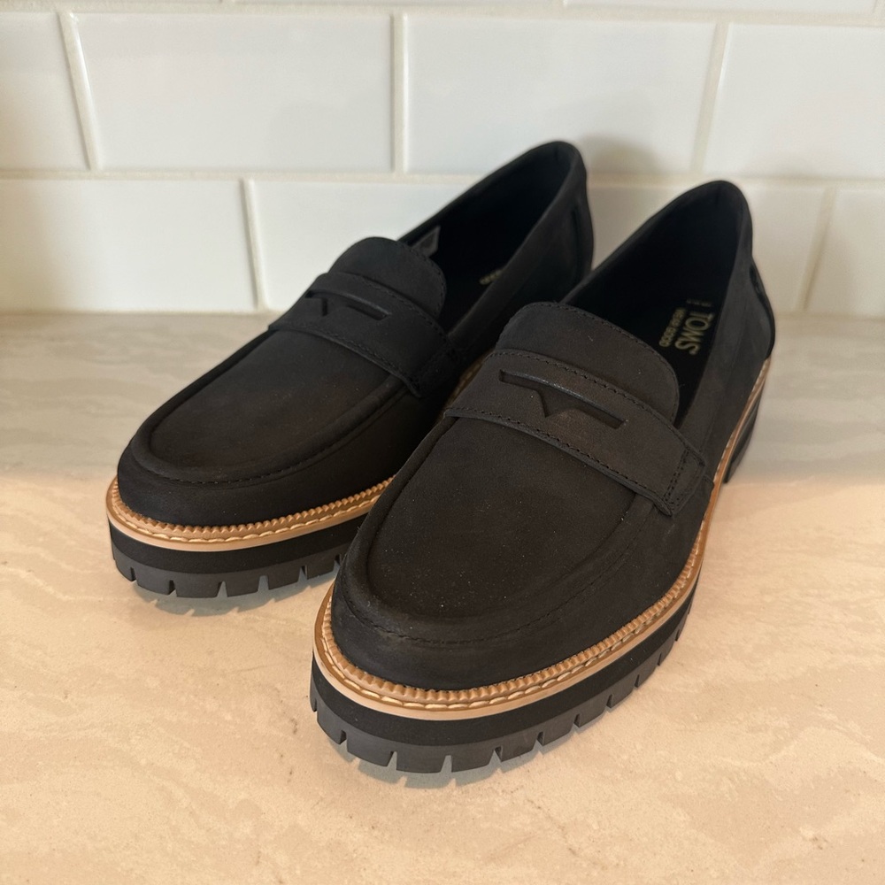 Toms black penny loafers